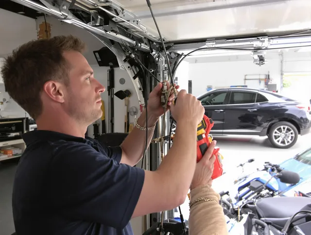 Georgetown Garage Door Repair safety certified technician performing cable replacement in Georgetown