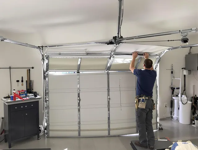 Georgetown Garage Door Repair specialist performing precise section replacement on Georgetown garage door